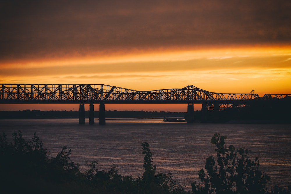bridge_over_river_at_sunset.jpg
