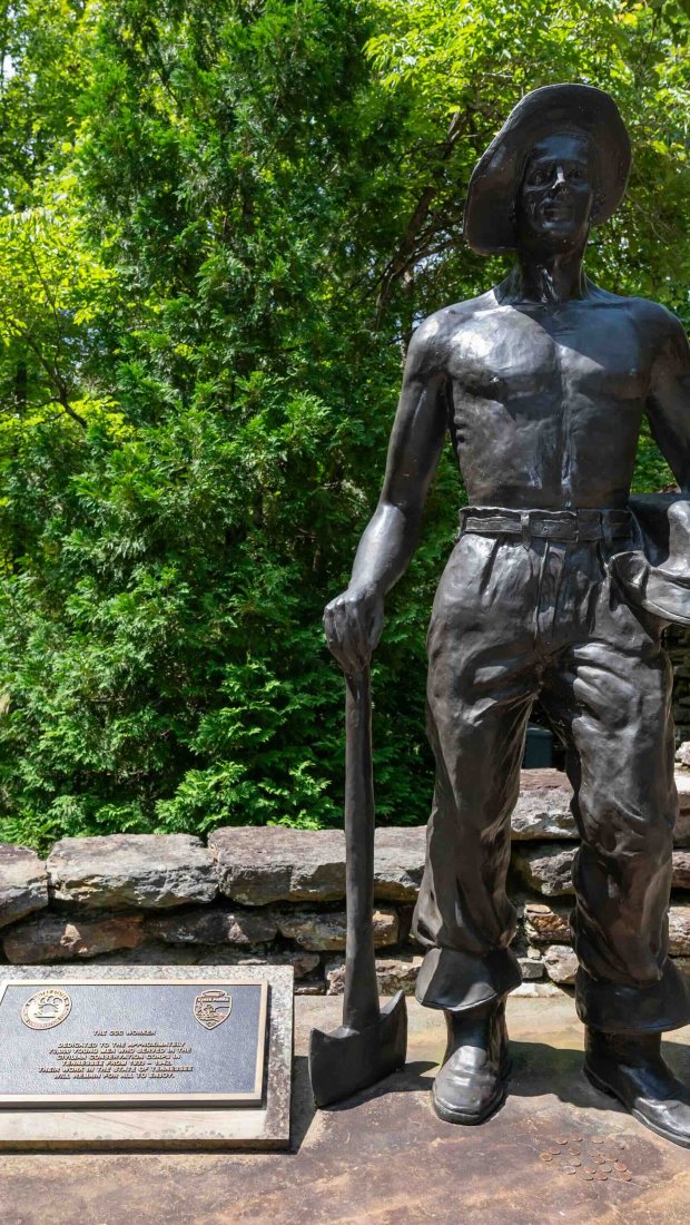 statue of historical CCC worker holding a shovel