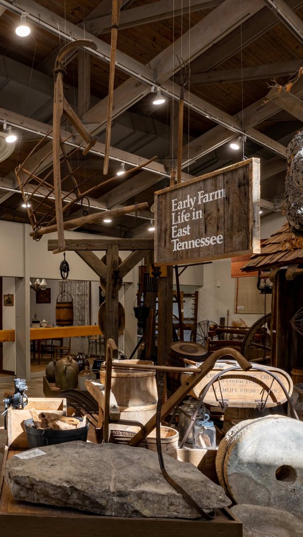 inside a museum with antique wood and stone items that was used in previous times
