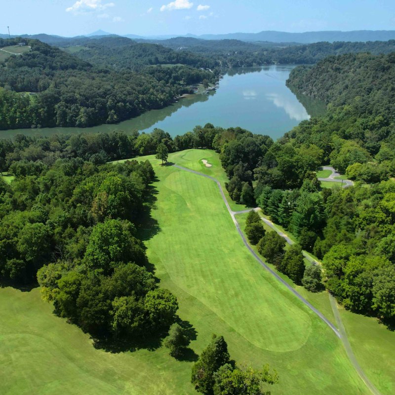 Aerial view of a winding river surrounded by lush greenery.