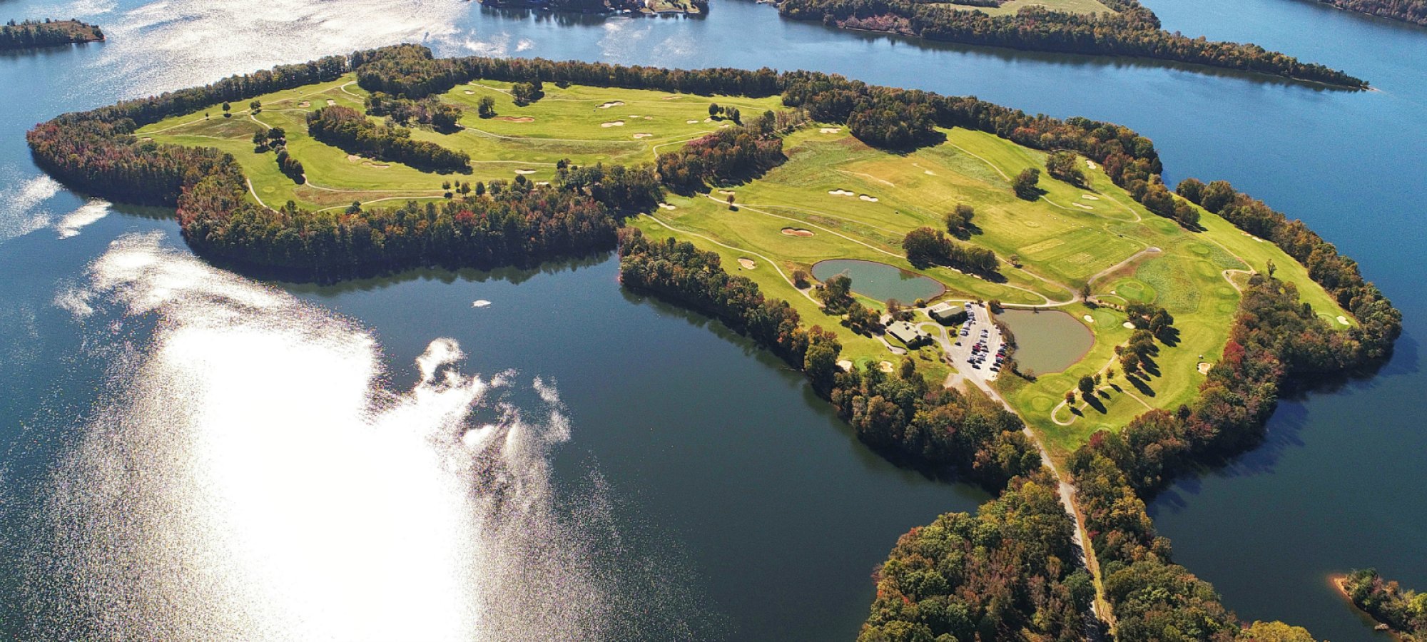 tims ford park aerial view of the island with a golf course and the lodging areas
