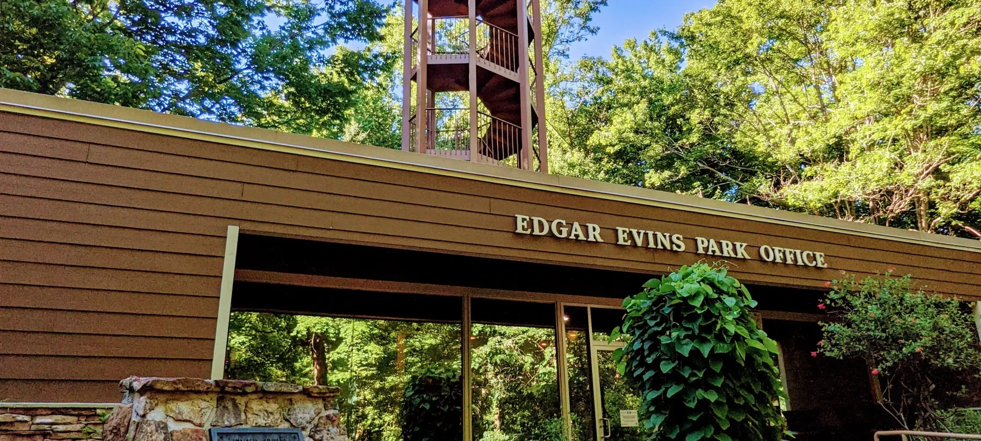 large wooden overlook with a sign under it that says Edgar Evins State Park