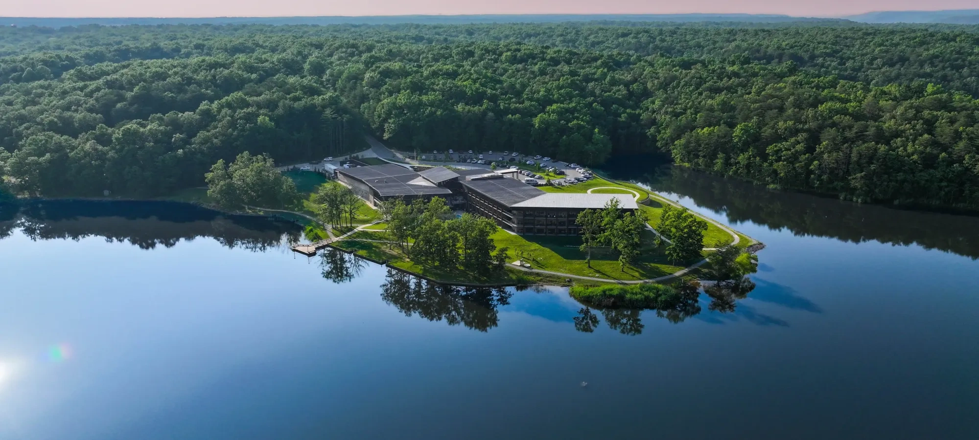 A beautiful lodge sit on the edge of a great, crystal clear lake. 