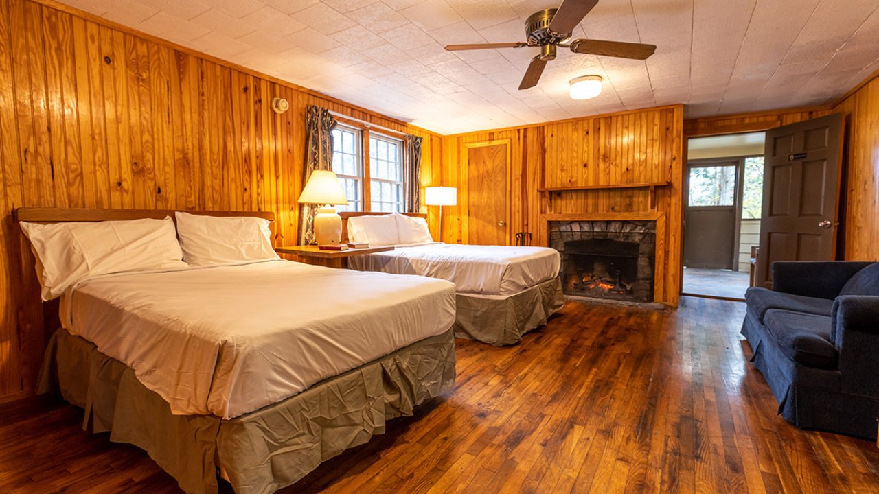 two bedroom cabin, well lit, wooden floors 