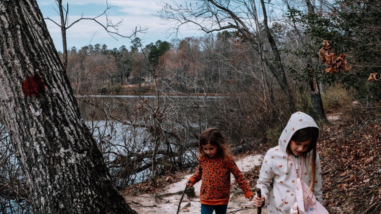 Children hiking on sandy trail at Chickasaw State Park