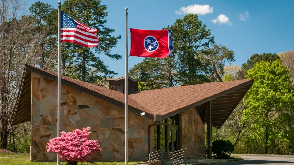 American flags flying on poles at Booker T. Washington State Park.