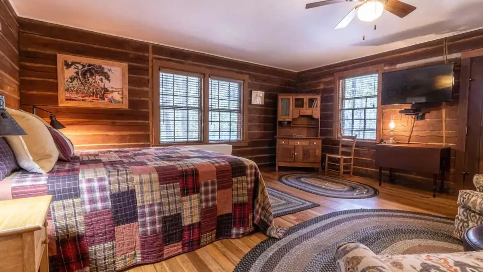 Another furnished cabin bedroom with similar decor.