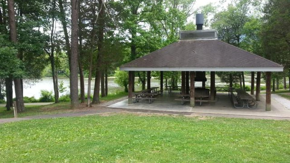 pavilion surrounded by grass and trees
