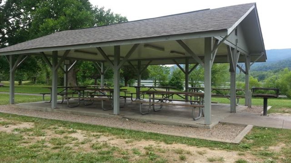 pavilion surrounded by grass and trees