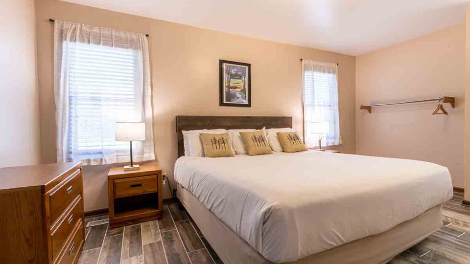 king sized bed with white covers