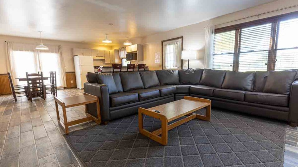 large black sectional couch in living room