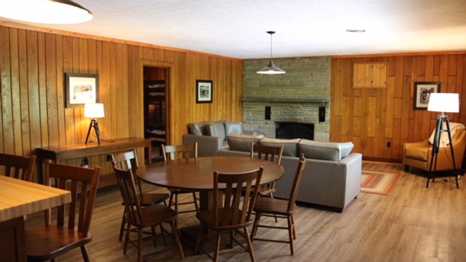 living room and dining room overhead lighting with few lamps, cozy