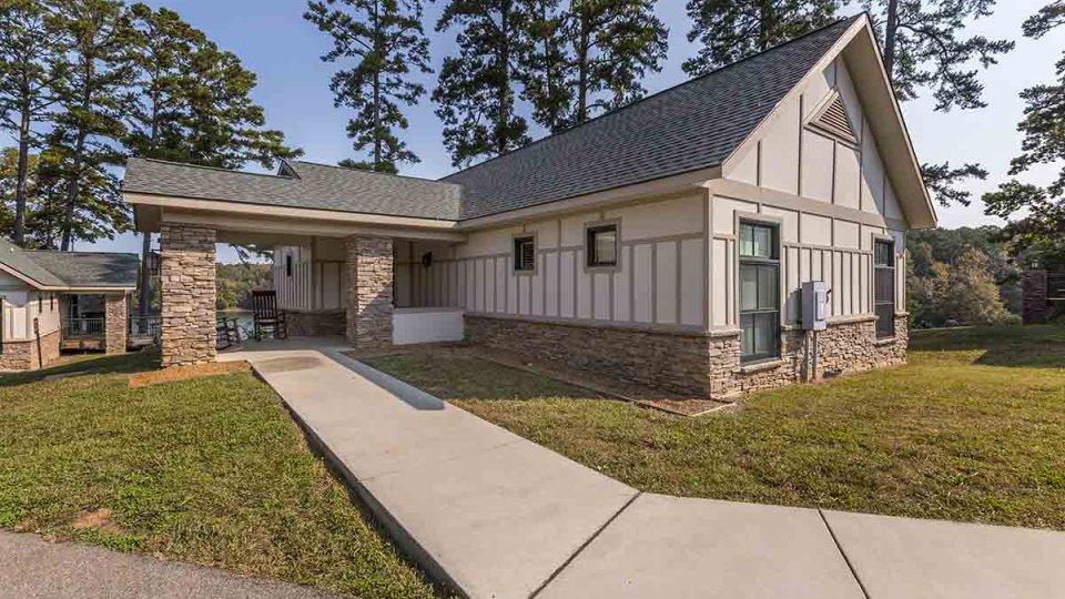 outdoor cabin that has a concrete path leading to the entrance