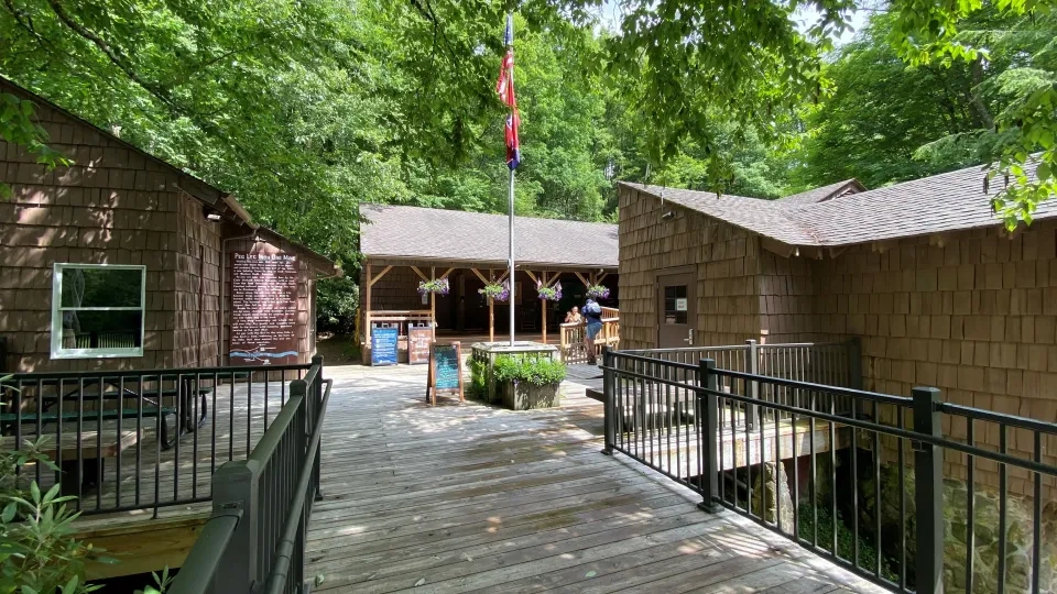 Entrance to Roan Mountain park office with a stone pathway and flowers.