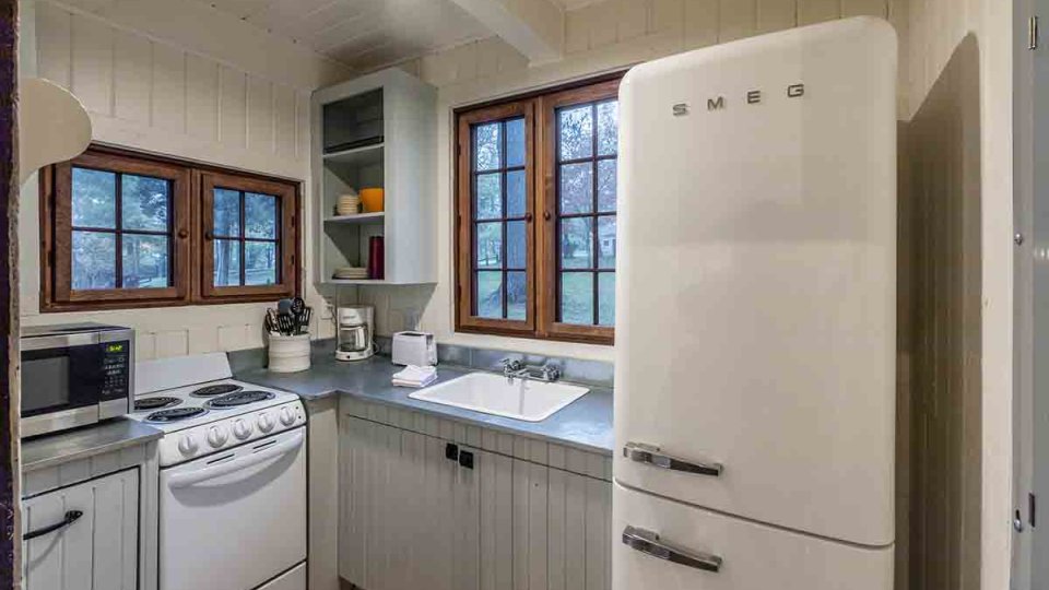 rustic cabin, white theme kitchen, vintage refrigerator, microwave