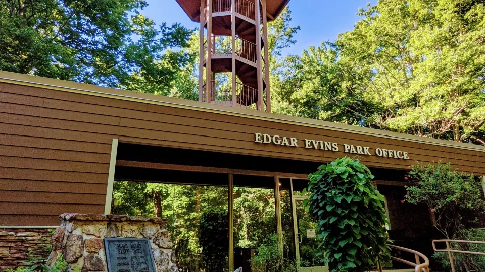 large wooden overlook with a sign under it that says Edgar Evins State Park