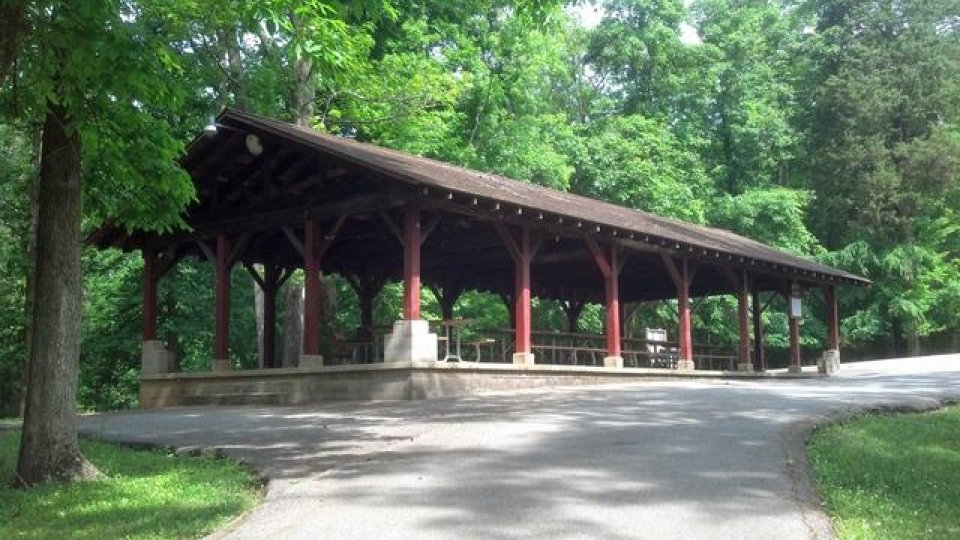 Shelter pavilion in a lush green park.