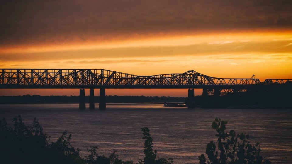 bridge_over_river_at_sunset.jpg