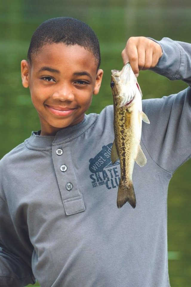 Youth Holding Bass