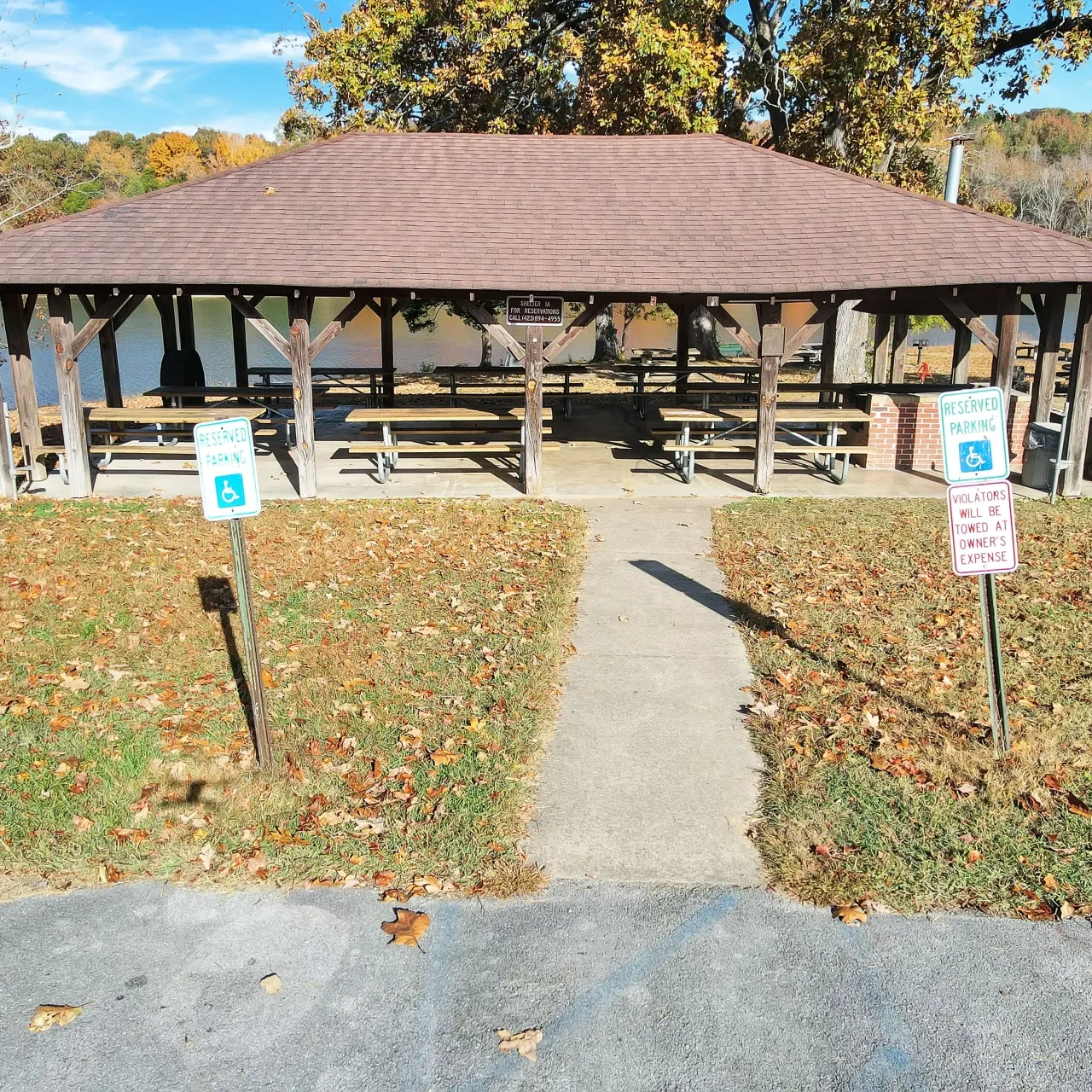 A shaded picnic area with tables at Booker T. Washington State Park.