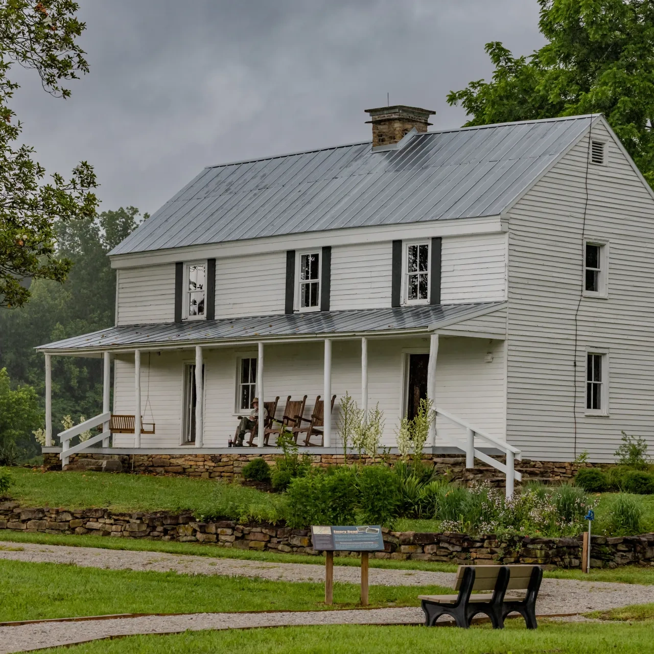 Kelly's white house with historical information sign in front
