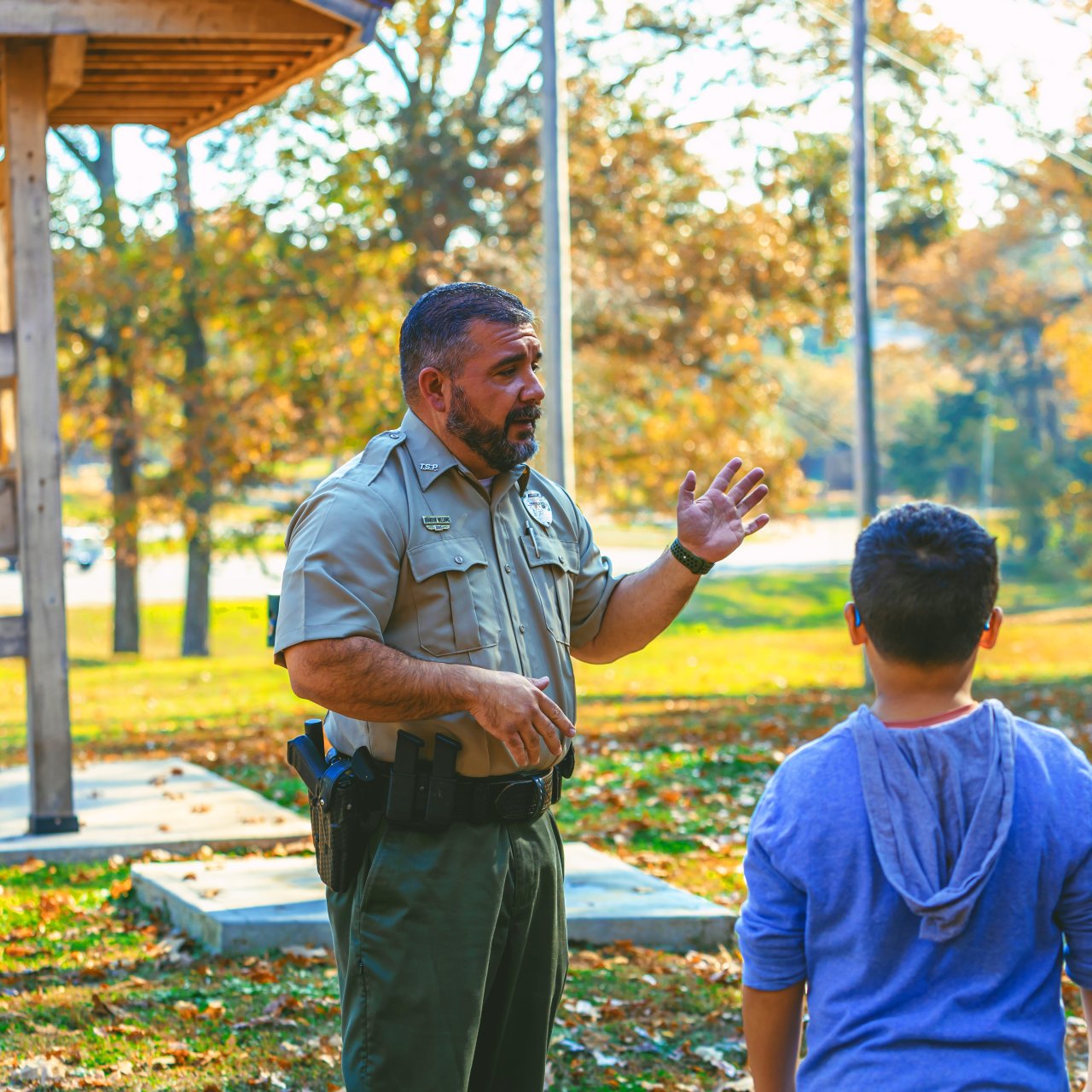 Ranger talking to people outside at Paris Landing